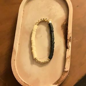 Cute tan and black bracket with gold beads